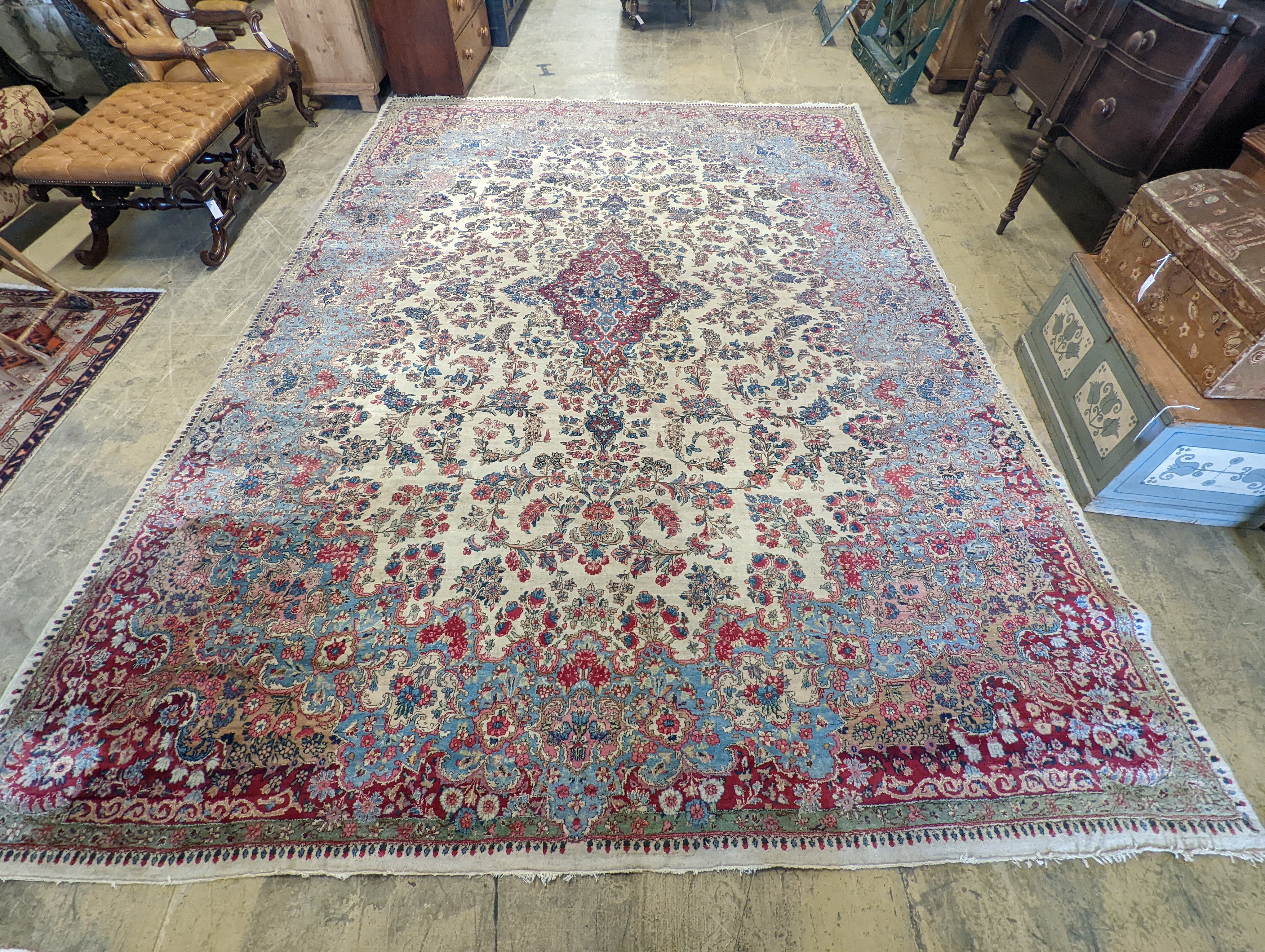 A North West Persian ivory ground carpet, 396 x 290cm